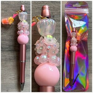 Pink beaded pen with drink charm